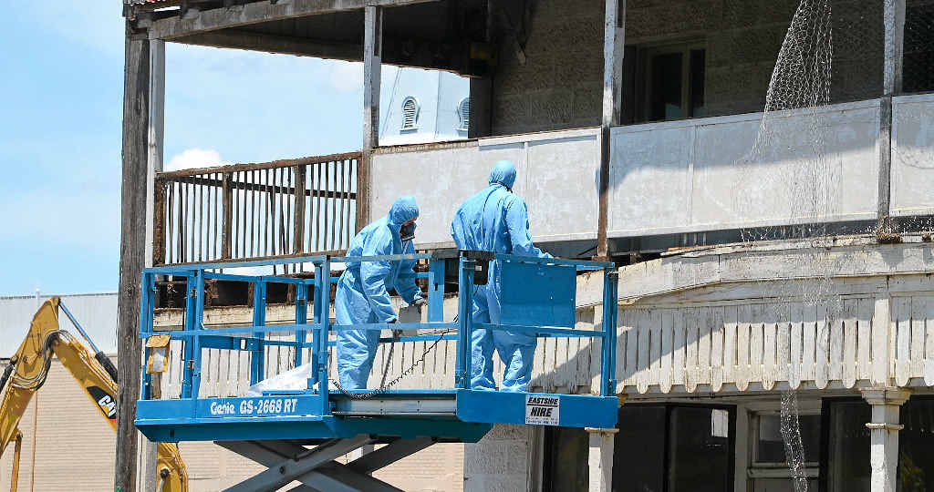 READY TO RESTORE: Workers removing wooden boards from the Plumbs Chambers building on Grafton St last week. READY TO RESTORE: Workers removing wooden boards from the Plumbs Chambers building on Grafton St last week.